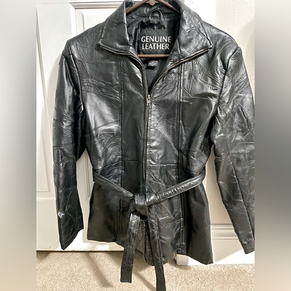 Textured leather jacket. Zipper and belt closure. No holes or tears. Size:Med.